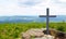 Cross on the mountain summit Svaroh. Sumava, Czech Republic.