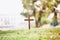 The cross standing on meadow sunset and bokeh background.