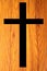 Cross symbol with  wooden background.