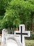 Cross on the tombstone in the public cemetery