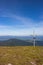 Cross on the top of mountains. Faith and memory sign. Vastness and peace concept.