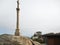 Cross and view of lighthouse on Cape Finisterre