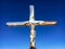 Cross with a wooden figure of Jesus Christ at peak of Klein Matterhorn mountain