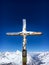 Cross with a wooden figure of Jesus Christ at peak of Klein Matterhorn mountain