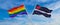 crossed flags of lgbt and Leather, Latex and BDSM Pride flag waving in the wind at cloudy sky. Freedom and love concept. Pride