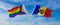 crossed flags of progress lgbt pride and Moldova flag waving in the wind at cloudy sky. Freedom and love concept. Pride month.