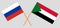 Crossed flags of Sudan and Russia