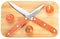 Crossed knives on chopping board