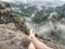 Crossed legs take a rest on mountain trail. Sweaty male legs