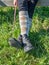 Crossed legs wear riding paddock boots and long knee socks.