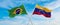 crossed national flags of Brazil and Venezuela flag waving in the wind at cloudy sky. Symbolizing relationship, dialog,