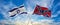 crossed national flags of Israel and confederate battle or Dixie flag flag waving in the wind at cloudy sky. Symbolizing