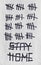 Crossed out Inscription Stay Home and signs tally marks counting the days on gray wall. Concept of isolation, quarantine and end o