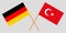 The crossed Turkey and Germany flags. Official colors. Vector