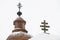 Crosses on top of Greek Catholic wooden church and belfry in Kalna Roztoka
