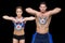 Crossfit couple posing with kettlebells