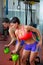 Crossfit fitness lifting Kettlebell woman at mirror workout