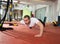 Crossfit fitness man balance pus ups with one leg and arm