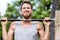Crossfit fitness man exercising chin-ups workout