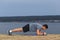 Crossfit training fitness man doing plank core exercise working out his midsection core muscles.