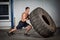 Crossfit training - man flipping tire