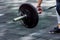 Crossfit woman preparing for her weightlifting workout with a heavy dumbbell