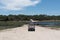 crossing the boteti river by car and passenger ferry in makgadikgadi pans national park, botswana