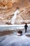 Crossing Frozen Zanskar River. trekking. Person pulling trekking bag. Chadar Trek