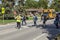 The crossing guard helps children to cross the street.