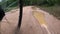 Crossing a muddy puddle with a bicycle in slow motion