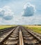 Crossing of railways under cloudy sky