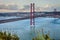 Crossing The Tagus River. Amazing Image of Lisbon Cityscape Along with 25th April Bridge Ponte 25 de Abril. Taken from Almada