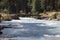 Crossing wooden brige on the mountian river