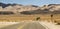 Crossroad on a desert with a scenic mountain landscape in Nevada