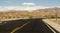 Crossroad on a desert with a scenic mountain landscape in Nevada