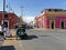 A crossroads with colorful houses and retro cars in a small Mexican town