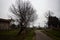 Crossroads in a group of houses on a cloudy day in the italian countryside