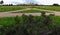 Crossroads and intersections of various wide and narrow gravel paths stretched away into the distance among expanses of green