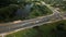 Crossroads of a large city highway. The flow of cars starts moving at a traffic light. Aerial photography