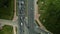 Crossroads of a large city highway. Taken from above. The flow of cars begins to move at a traffic light. Aerial photography