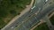 Crossroads of a large city highway. Taken from above. There is a stream of cars. Aerial photography