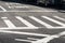 Crosswalk in the city street intersection asphalt road with marking lines and signs
