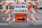 Crosswalk closed and detour signs