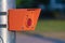 Crosswalk traffic button. Orange warning symbol