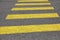 Crosswalk yellow lines on the road. zebra yellow pedestrian crossing