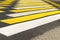 Crosswalk yellow-white warning bright color.