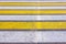 Crosswalk. Yellow and white zebra pedestrian crossing in summer during the daytime