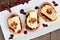 Crostini with cranberry sauce, apples, brie and pecans, above view