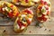 Crostini with roasted bell pepper, goat cheese, garlic and herbs