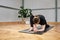 crouched woman with no recognizable face practicing yoga